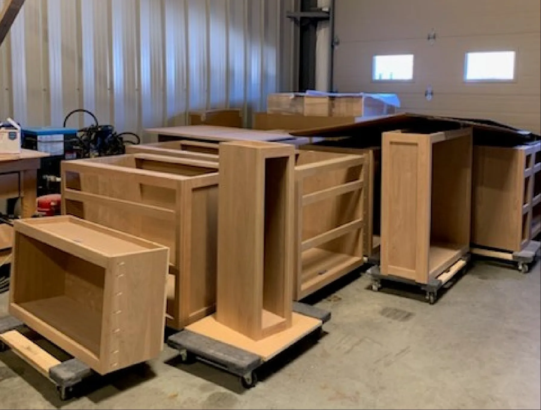 Multiple cabinet frames assembled and ready on dollies