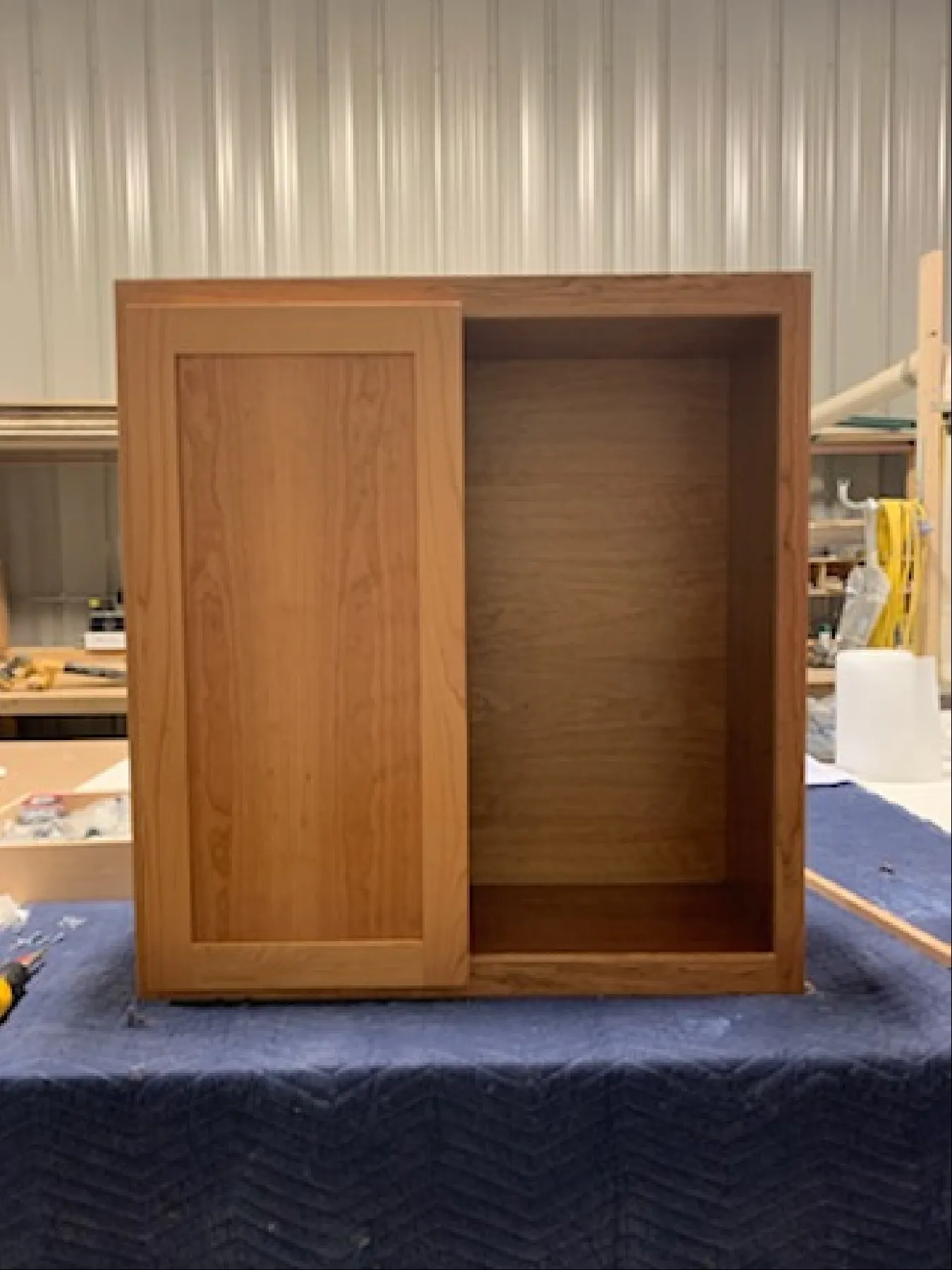 Finished cabinet with door panel installed